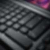 Close-up of an older MacBook Pro showcasing keyboard and screen