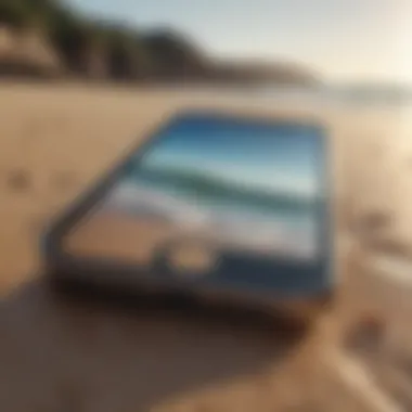 A pristine iPhone resting on a beach, highlighting its outdoor durability